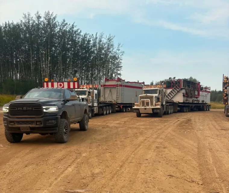 Leading two haulers down a dirt road