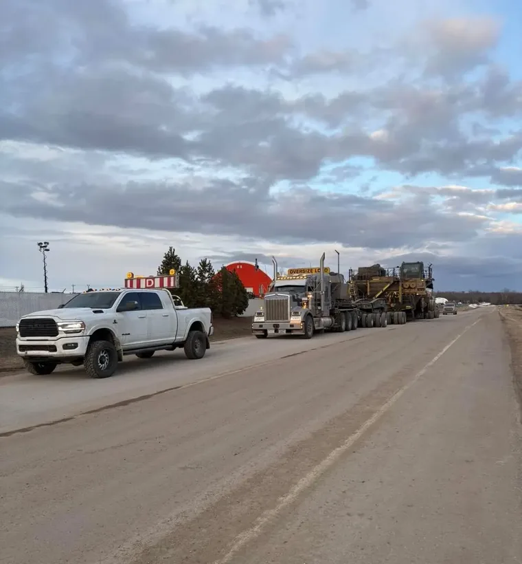 Pilot truck ahead of an oversized load