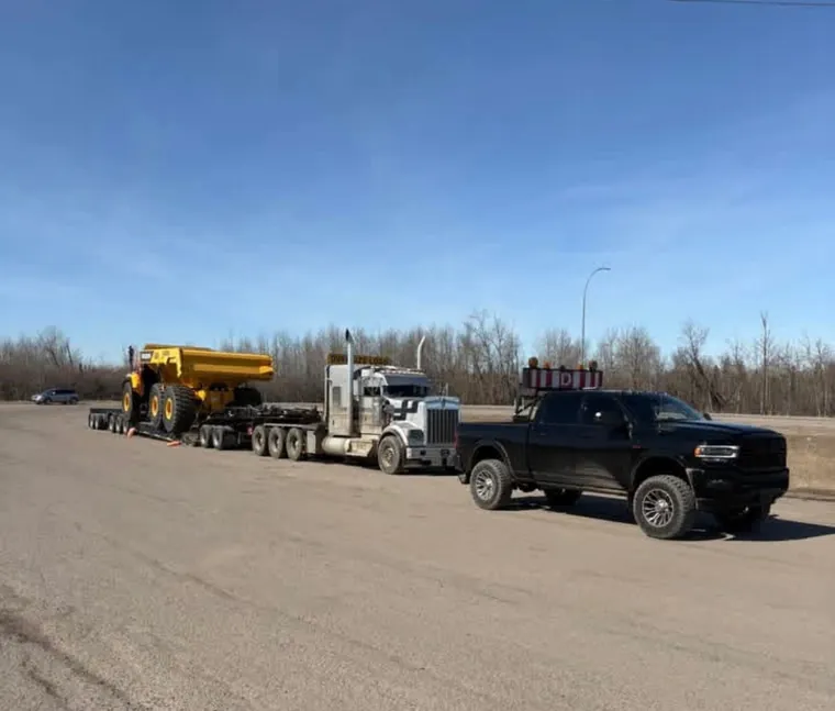 Escorting a loaded lowbed off the pad