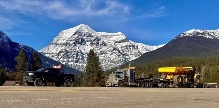 Lowbed running with the mountains behind